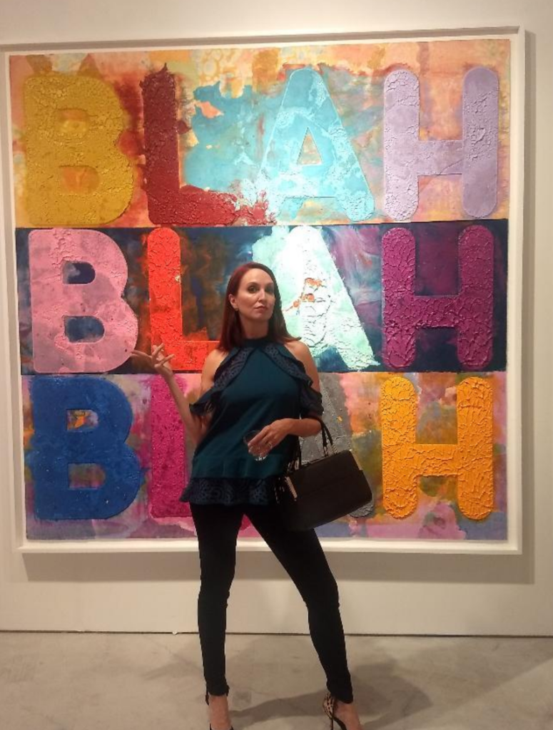 Kat Barrow-Horth with Mel Bochner's "Blah Blah Blah" at Art Miami.