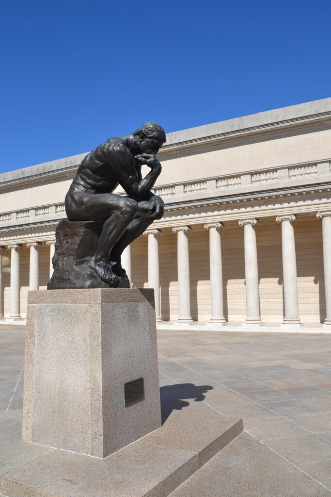 Full view of Auguste Rodin's Le Penseur (The Thinker), monumental bronze sculpture at Palace Legion of Honor, In San Francisco. 