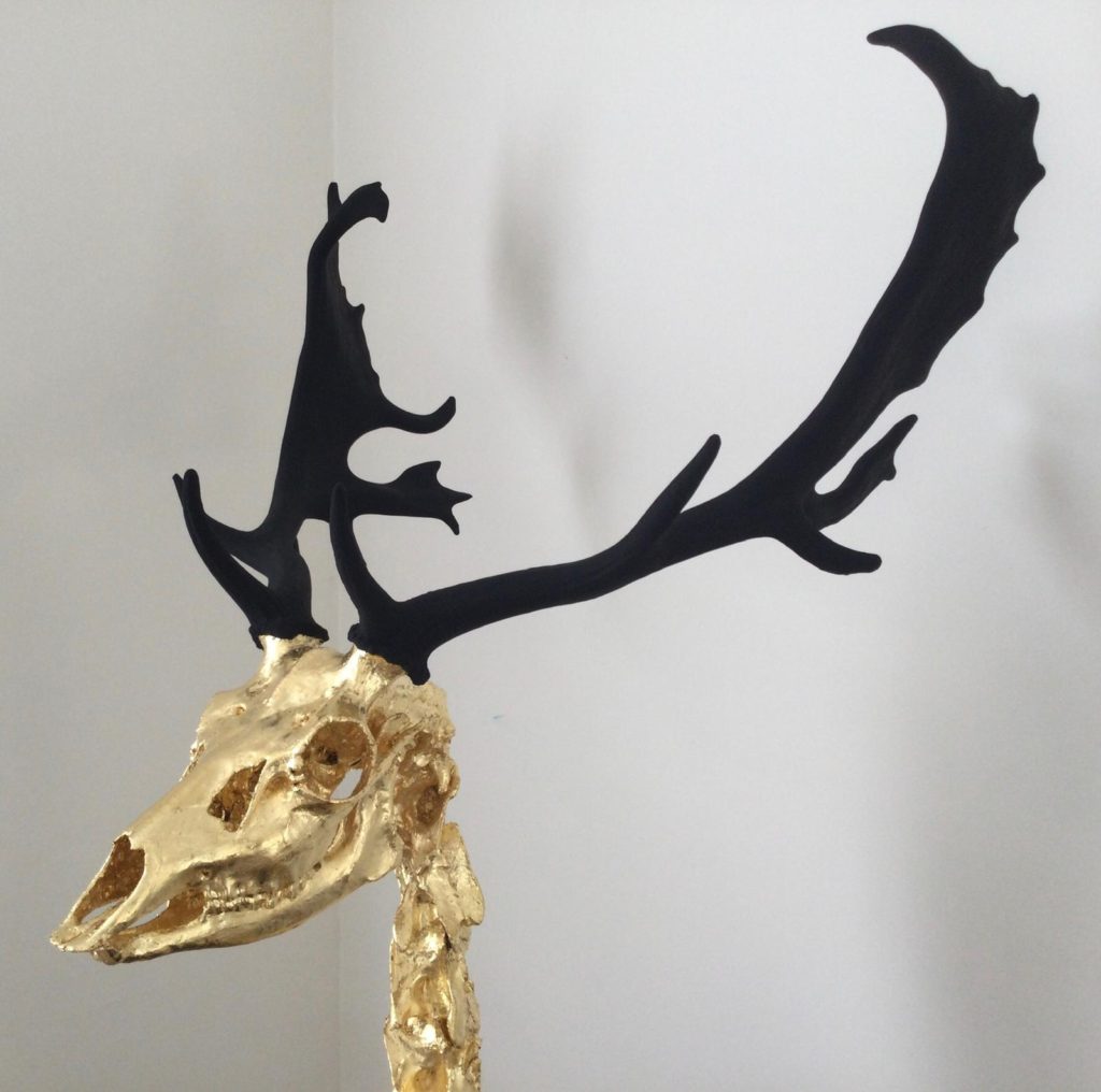 Stephen Cawston's "Imperial" Buck skeleton with 24 carat gold and matte black paint sculpture.